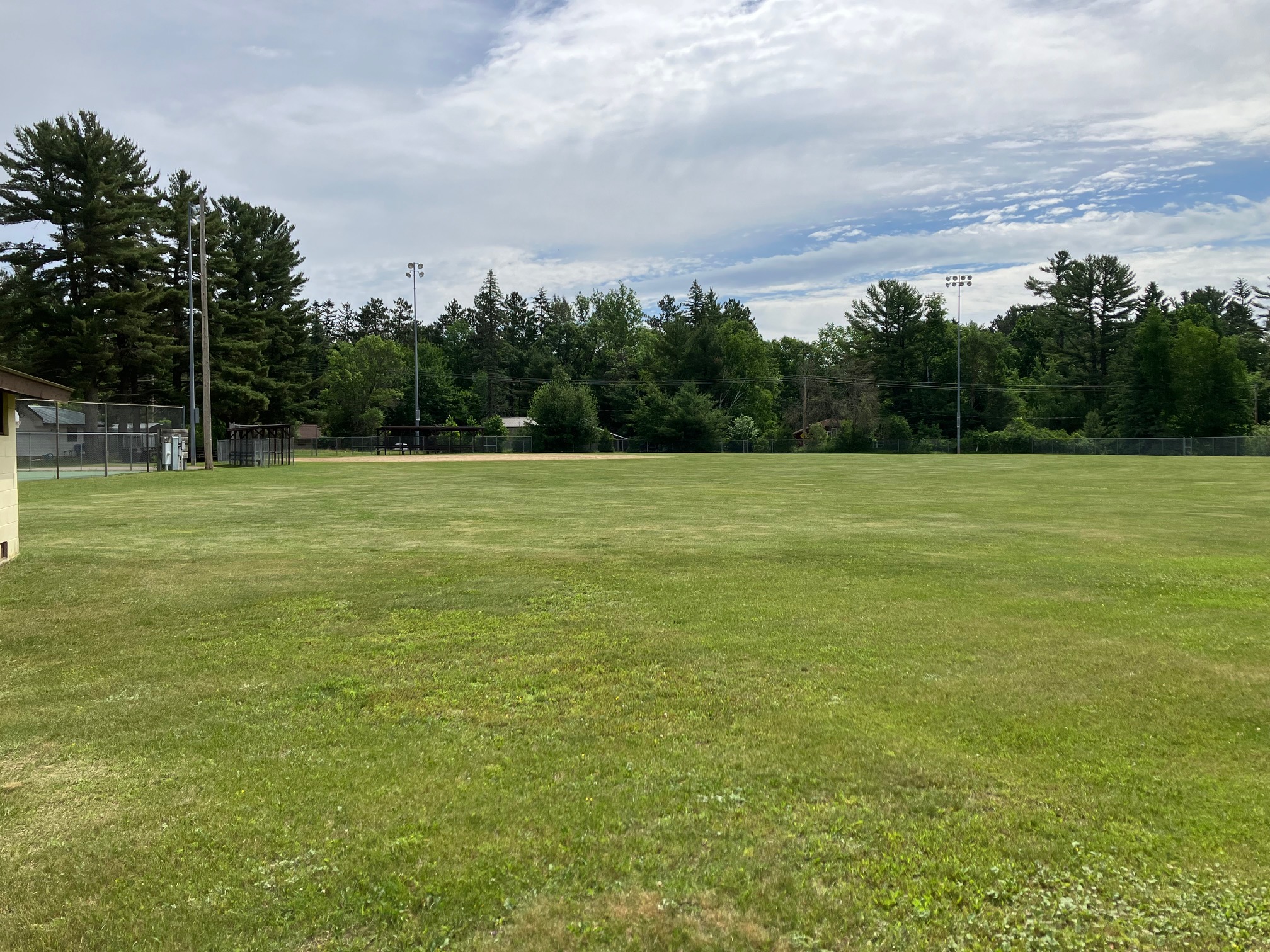An overview of a grassy community athletic field